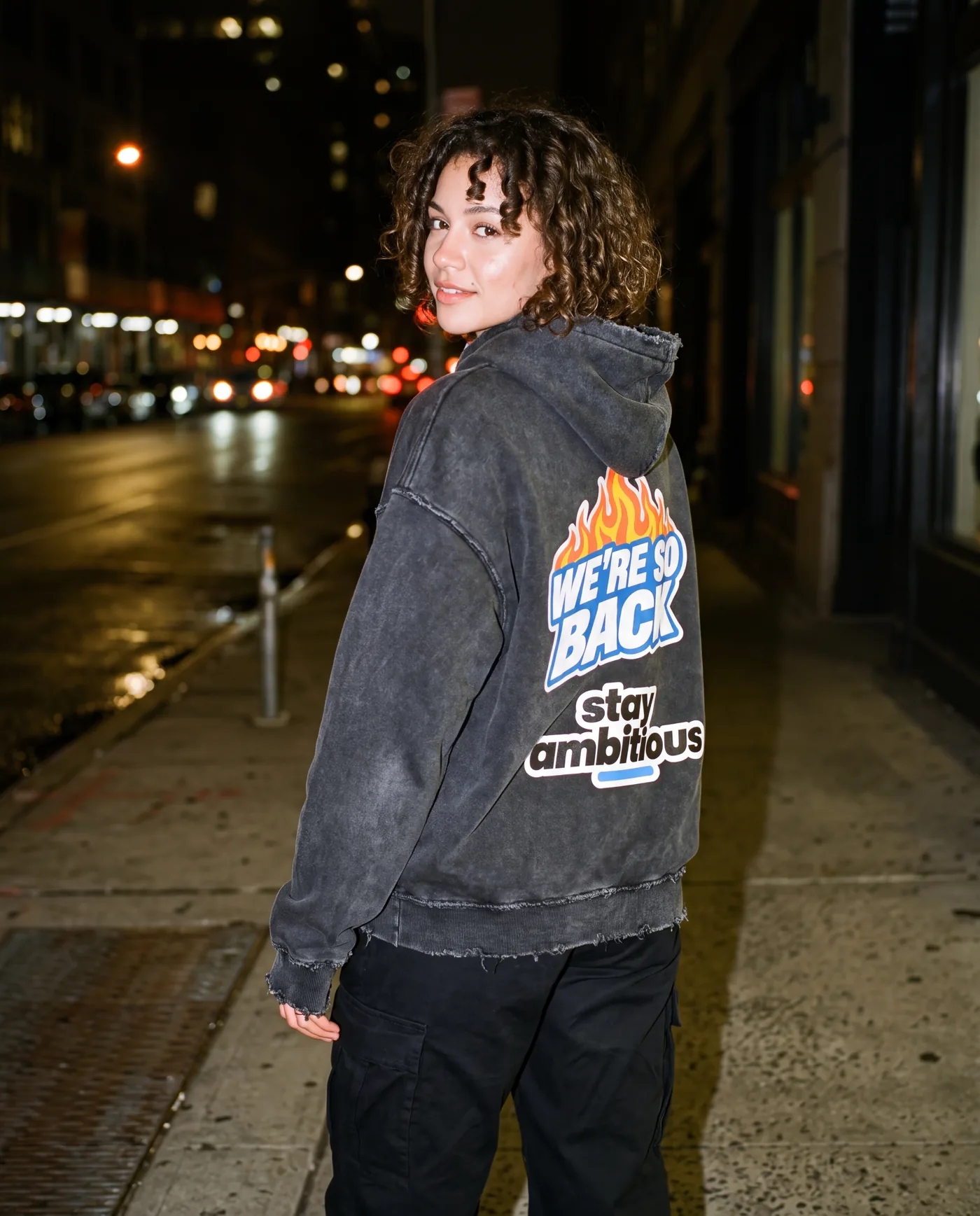 We’re So Back hoodie at night